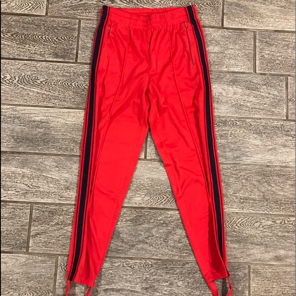 Red track pants